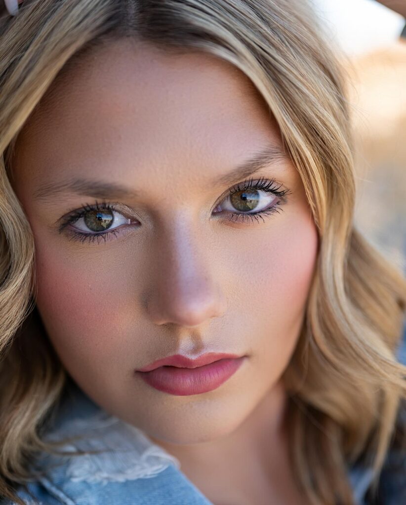 Modeling in floral styling with soft natural light in a rocky outdoor setting