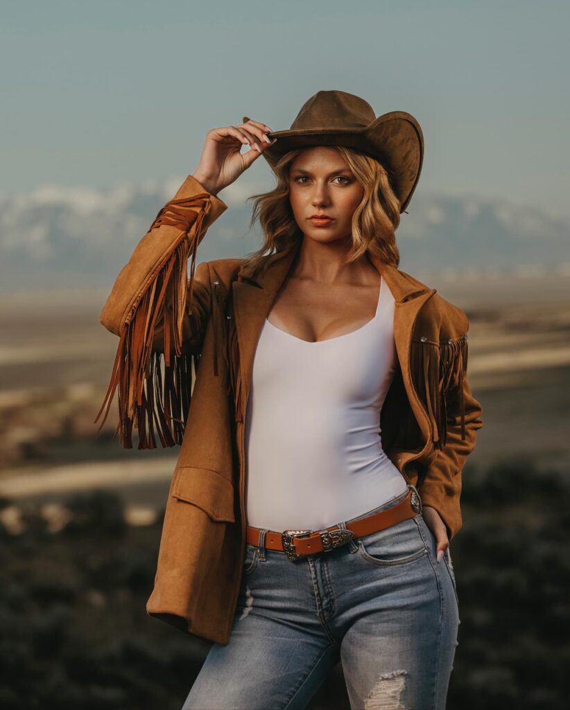 Modeling suede jacket and Western styling in a rugged mountain setting